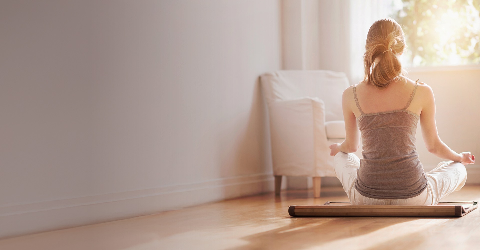 Woman doing Yoga on Hardwood Floor
